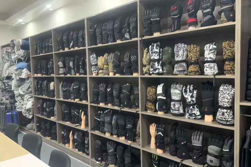Heated gloves manufacturer showroom displaying wholesale OEM custom thermal gloves