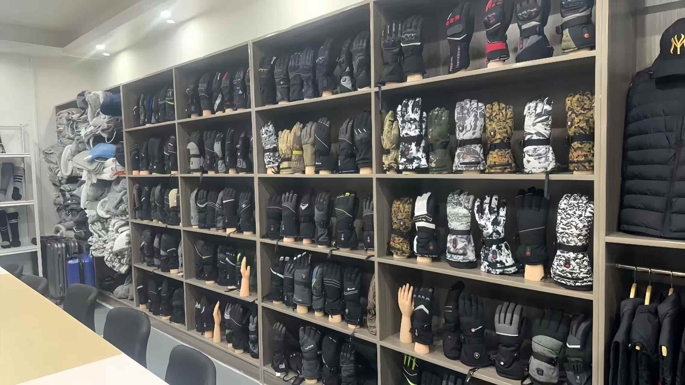 Heated gloves manufacturer showroom displaying wholesale OEM custom thermal gloves